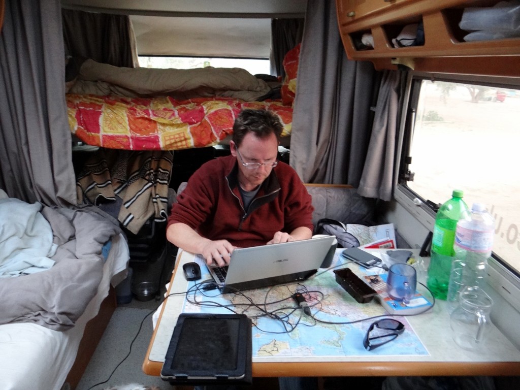 Jay on the road writing an ourtour blog post in Dave, our Hymer B544 motorhome