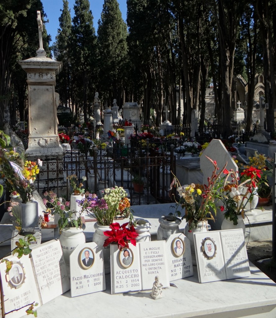 Italian graves are for the whole family, each member gets their own 'souvenir' plaque with their photo on