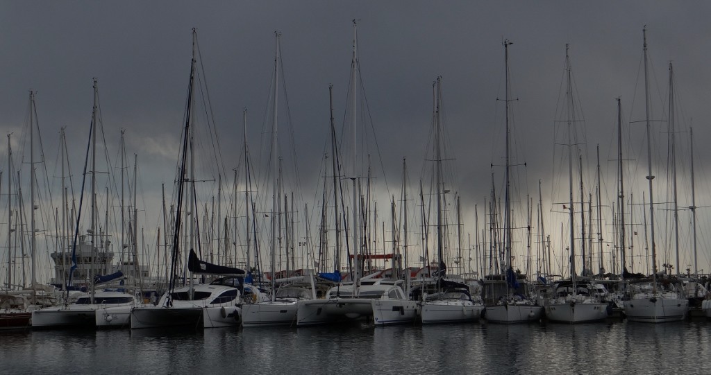Dark clouds are gathering over the boats, it might rain Dave clean!
