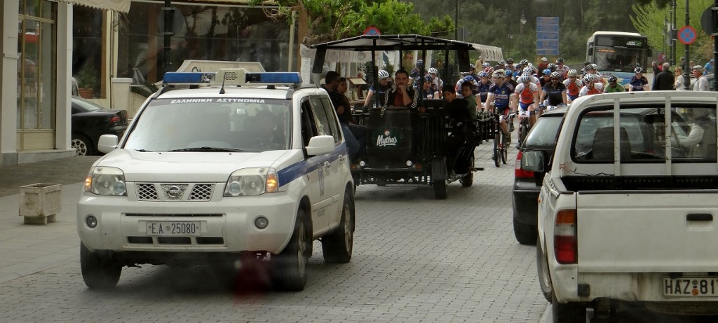 An Olympia cycle race (just behind the police car they are riding a cycling bar - so suspect it's not a serious race)