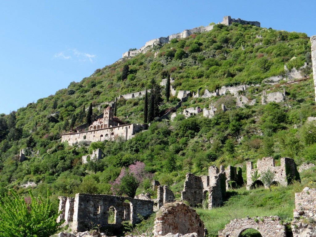 Mystras - ruins and restoration topped by a castle.