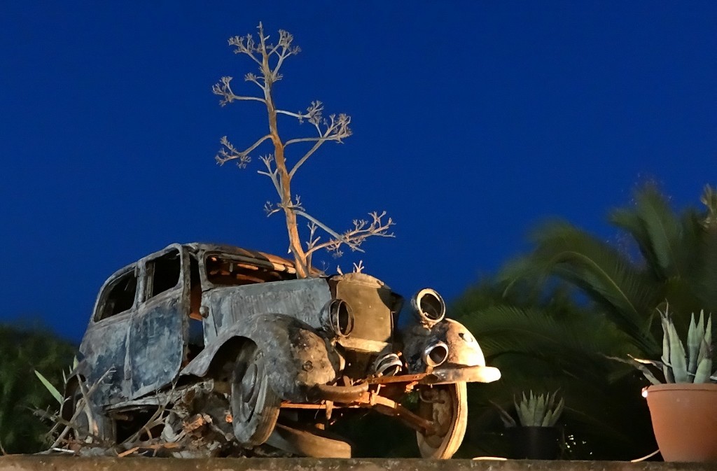 Old car on top of the taverna