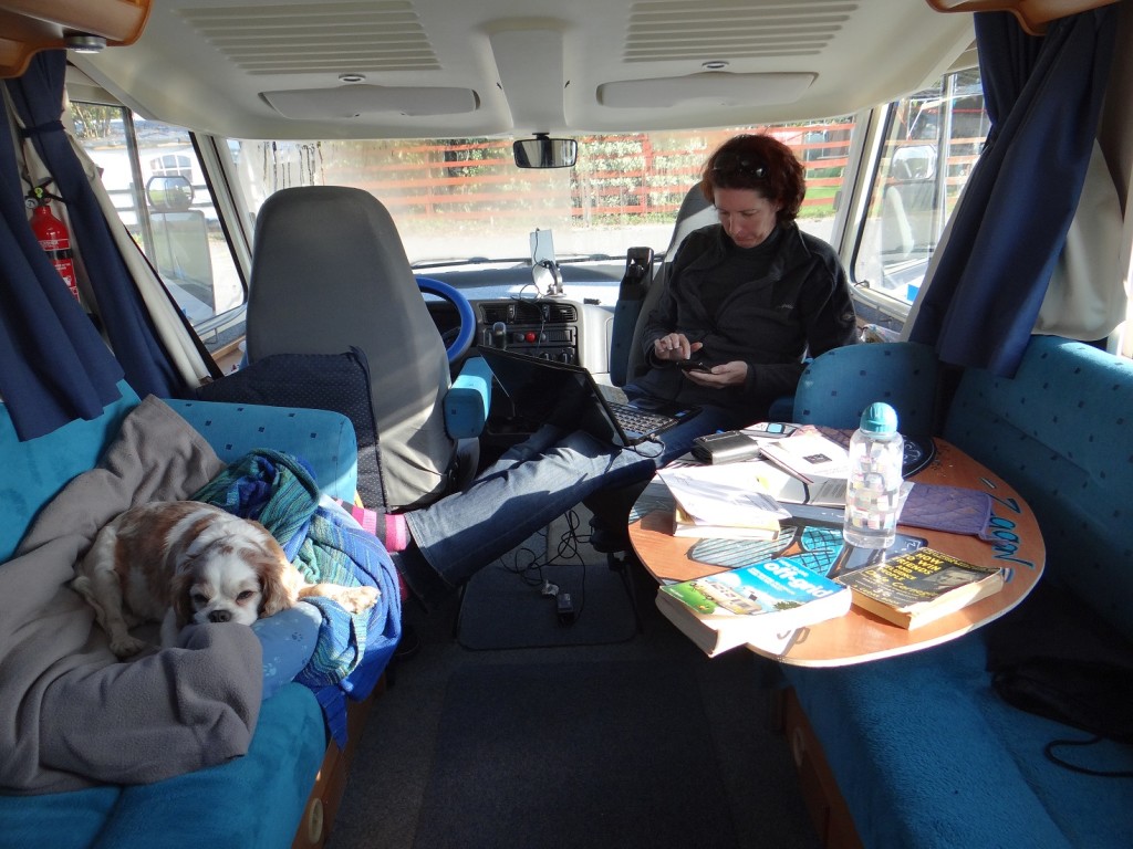 The living space in our motorhome with a captain's chair and swing-out table