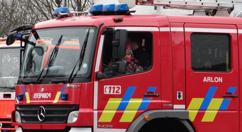 Local kids being entertained by Belgium's firemen.