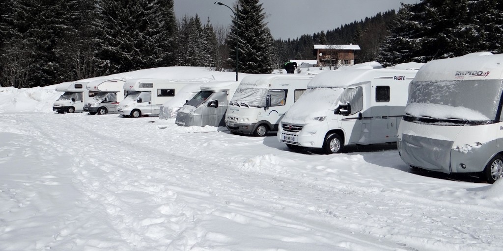 The snowy motorhome ski aire at Le Praz de Lys in the French Alps