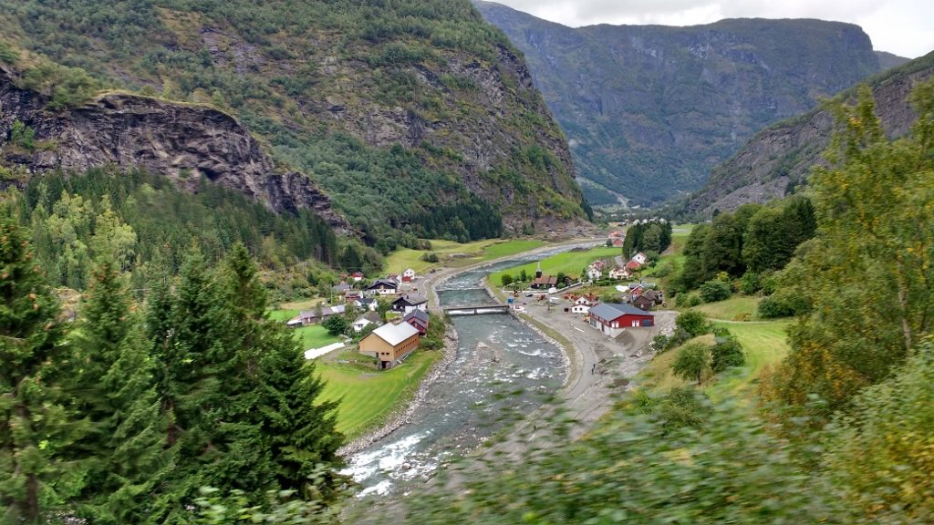 Flåm Village, where real people live, set a bit inland from the weird transit post against the sea