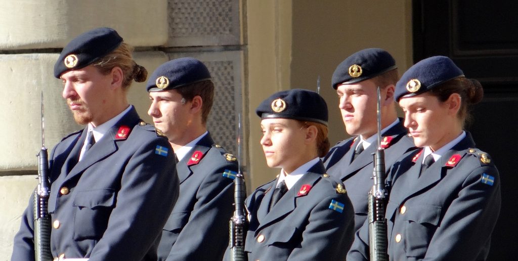 The Royal Guard's drawn from across Sweden's armed forces. At the moment it's the turn of the army's Air Defence units. A small insight into how Sweden thinks, maybe, with one royal guard sporting a goatee and hair bobble, and two ladies in the guard