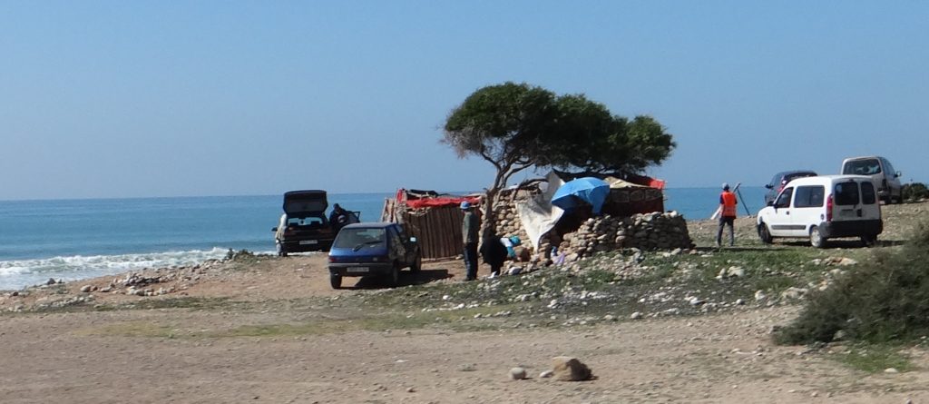 Our motorhomes and worldly comforts compare with the locals sat on the beach