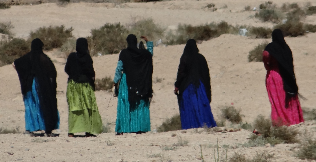 More Moroccan ladies in the traditional 'bright clothes, black throw' dress of this area