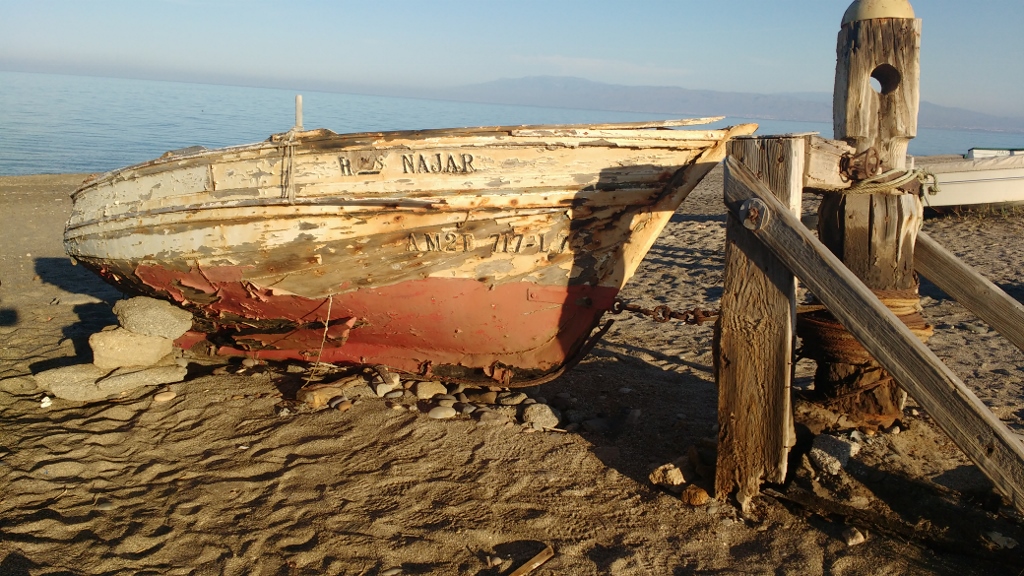 Ancient fishing boats and winding gear on the Cabo de Gata beach alongside us