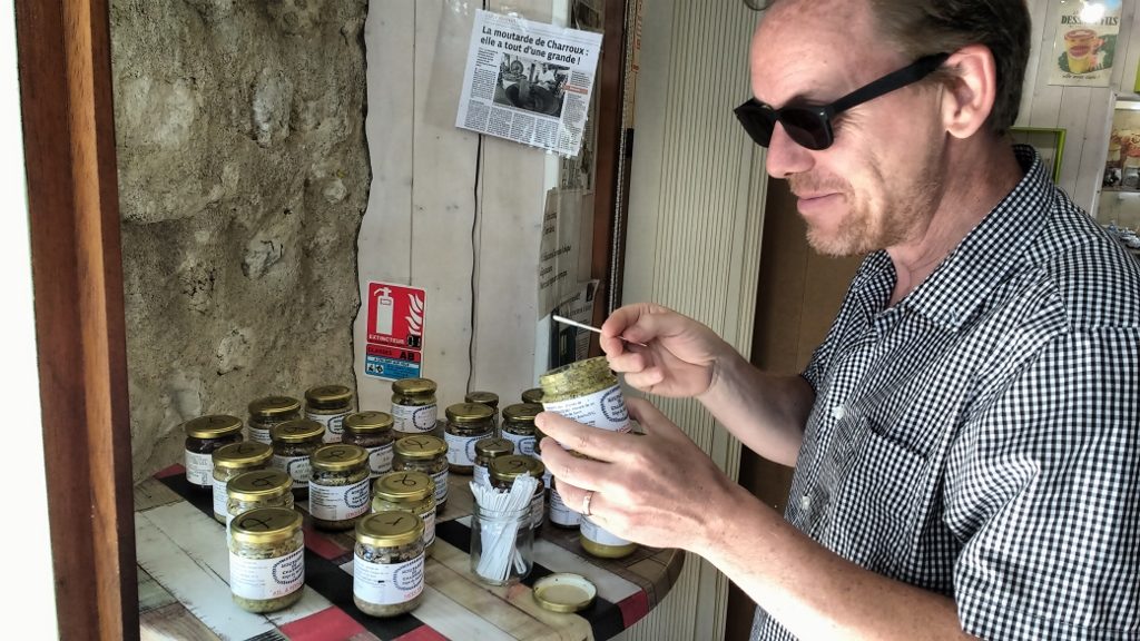 Mustard tasting in Charroux. I liked all of 'em, a message my face doesn't appear to convey...
