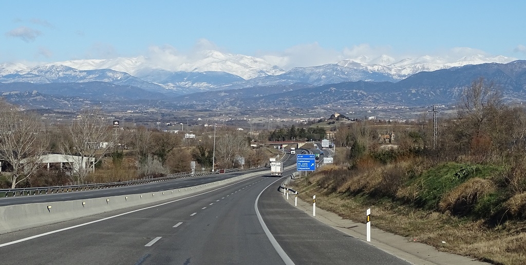 Driving across inland Catalonia with the Pyrenees as an epic backdrop
