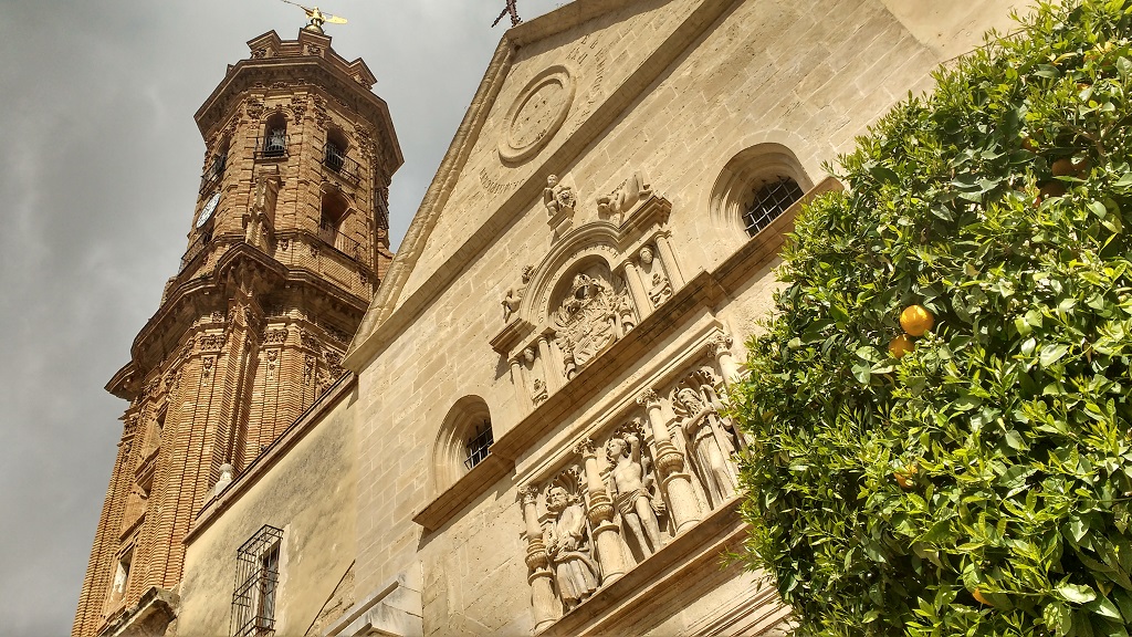 One of Antequera's many churches, with oranges ripening in early March