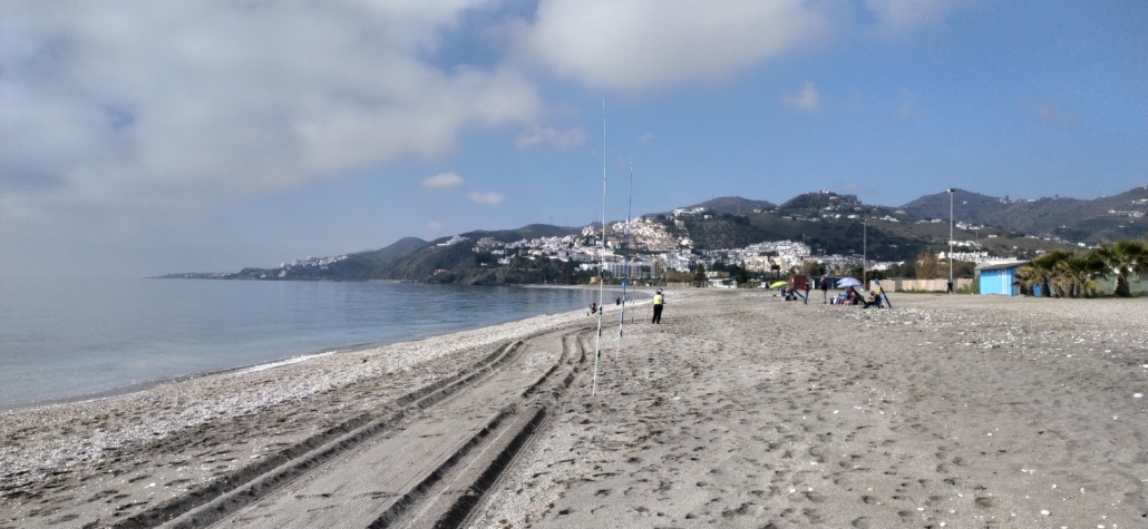 Locals out fishing closer to the campsite on Playa Playazo in Nerja