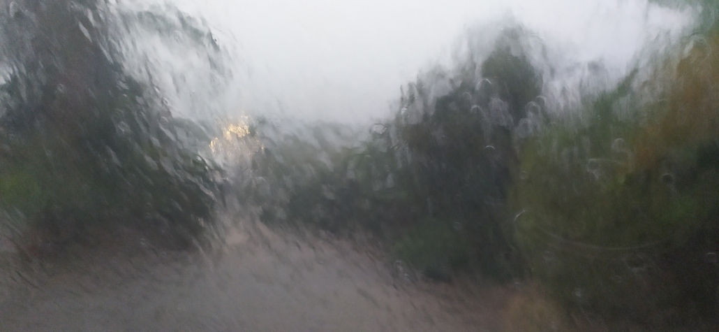 Heavy rain from a motorhome window.