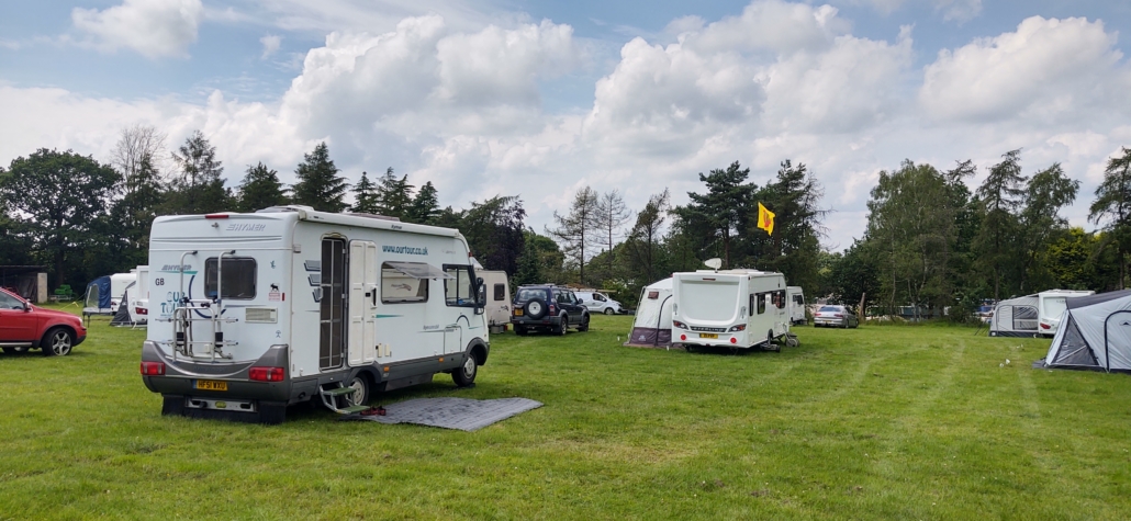 A Motorhome and Caravans at a Camping and Caravanning Club Temporary Holiday Site