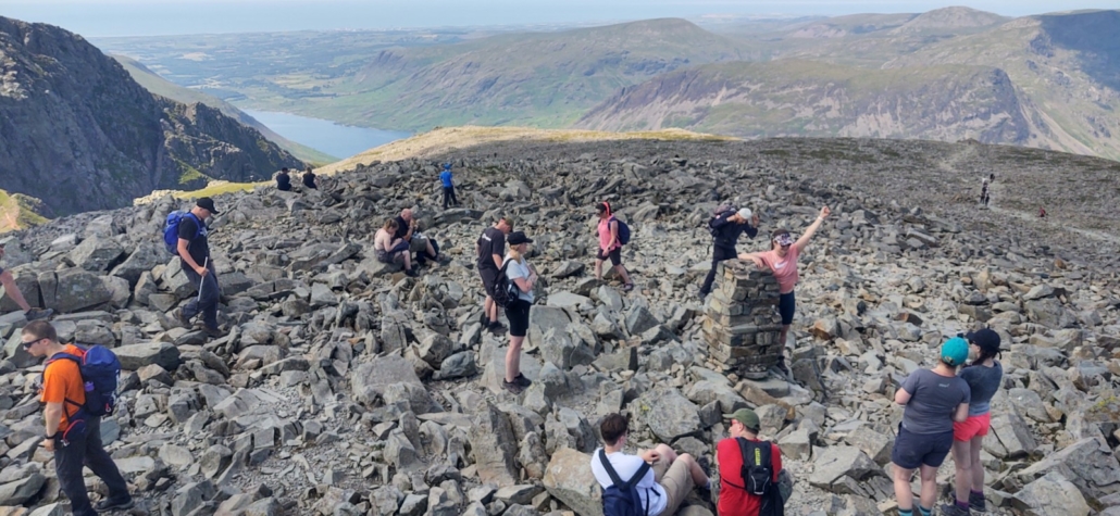 Fellow hikers on the summit of Scafell Pike, many thousands head up here each year, usually in worse weather!