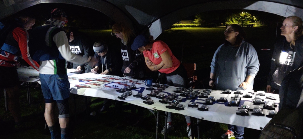 Picking up race numbers and GPS trackers at the start of the GB Ultras Snowdon 50 ultramarathon