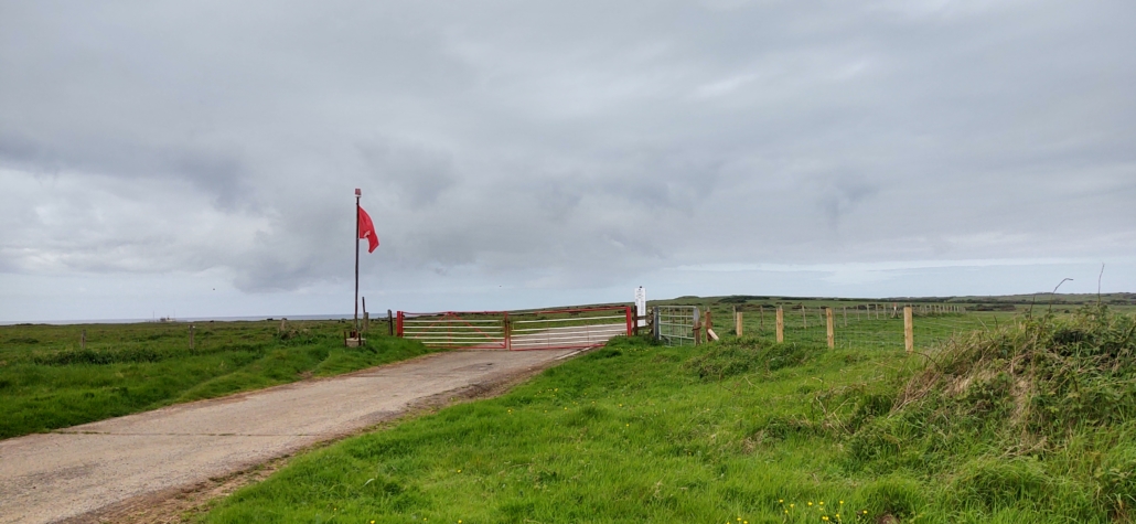 A red flag at Castlemartin Range on the way to St Govan's indicating live firing is taking place