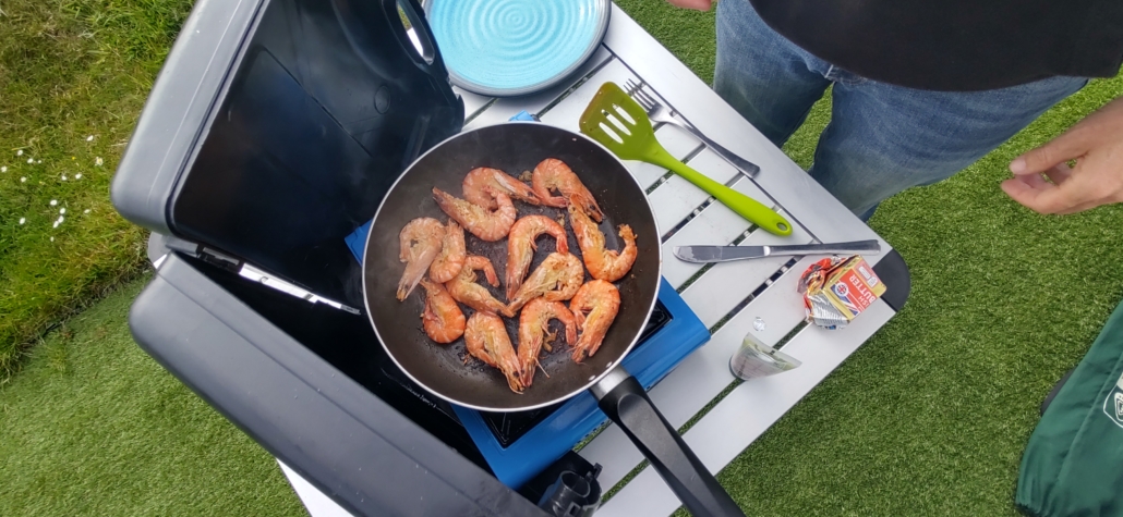 Cooking prawns campsite gas stove outdoors