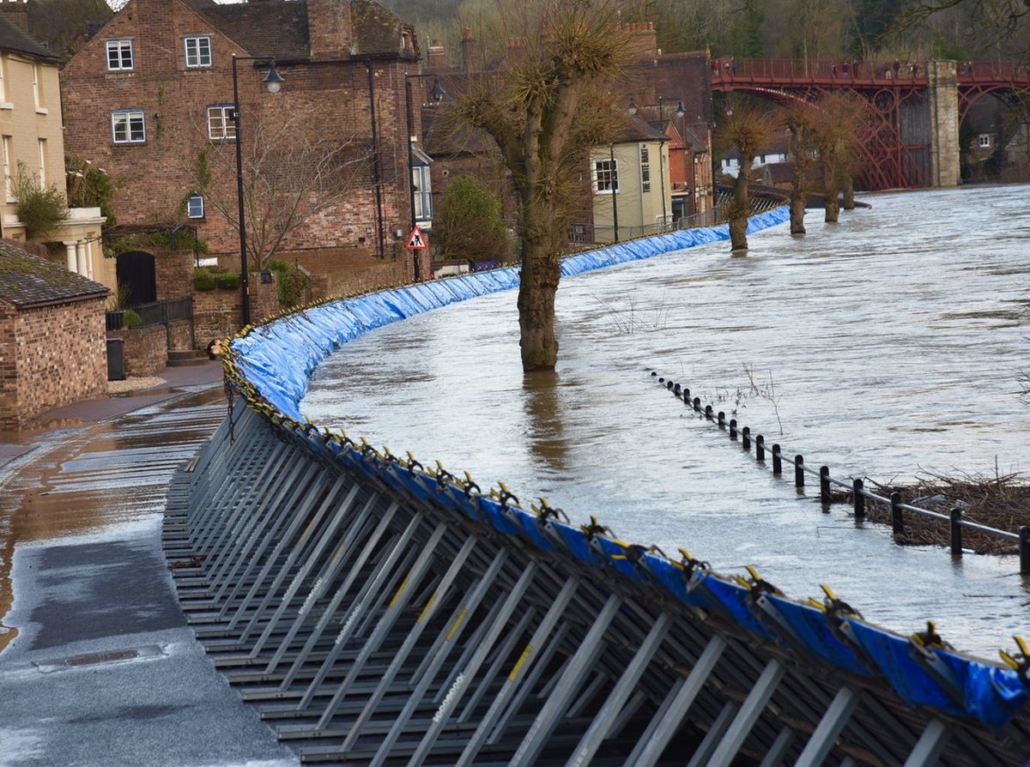 Squeaky bum time as Ju would say! The Severn almost breached flood defences at Ironbridge earlier this year . Photo: Geodesign Barriers www.geodesignbarriers.com