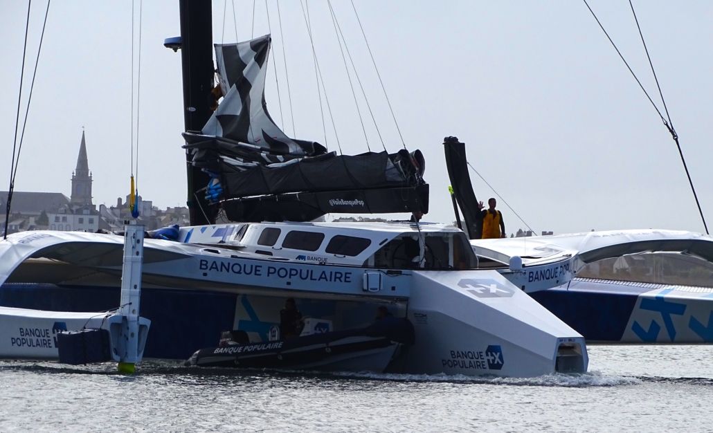 The Banque Populaire XI being towed backwards. As far as I can tell, this thing is built to break world records. It looks very, very expensive.