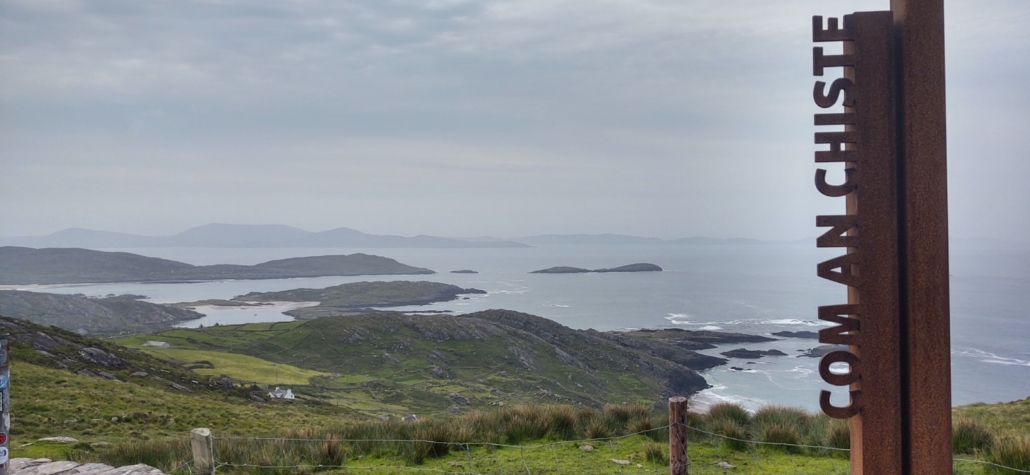 view of Irish coast and 'Com an Chiste' sign post