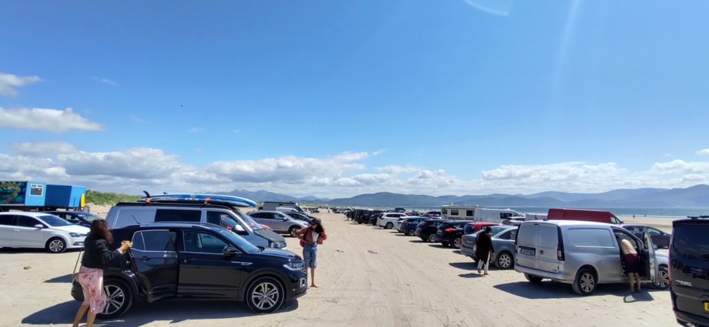 cars parked on the sand at beach