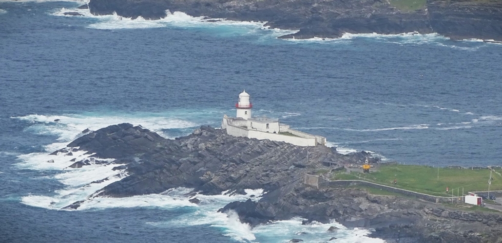 View of Valentia Lighthouse, itself built in an old sea fort, from the parking on Geokaun Mountain