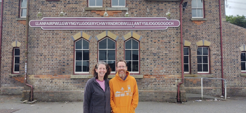 Llanfairpwllgwyngyllgogerychwyrndrobwllllantysiliogogogoch Europe's longest place name train station sign Anglesey Wales