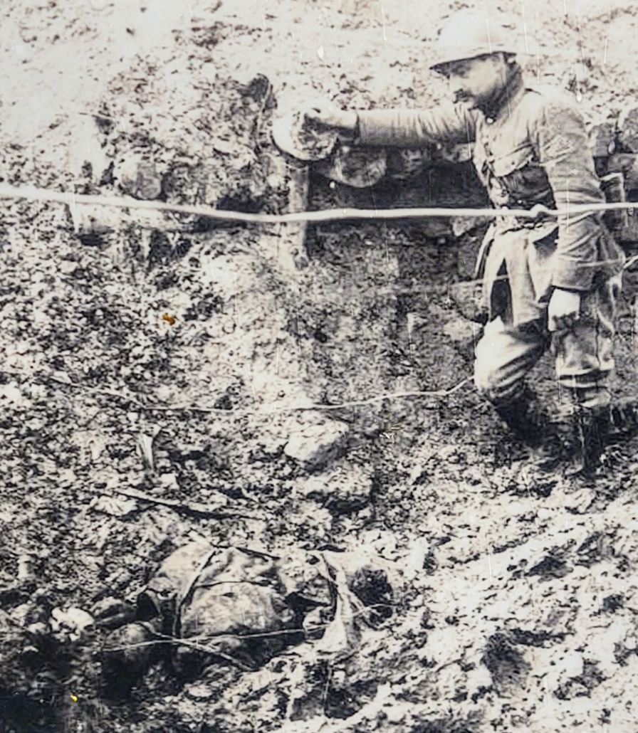 A WW1 soldier overlooking a dead comrade, Chemin des Dames, France