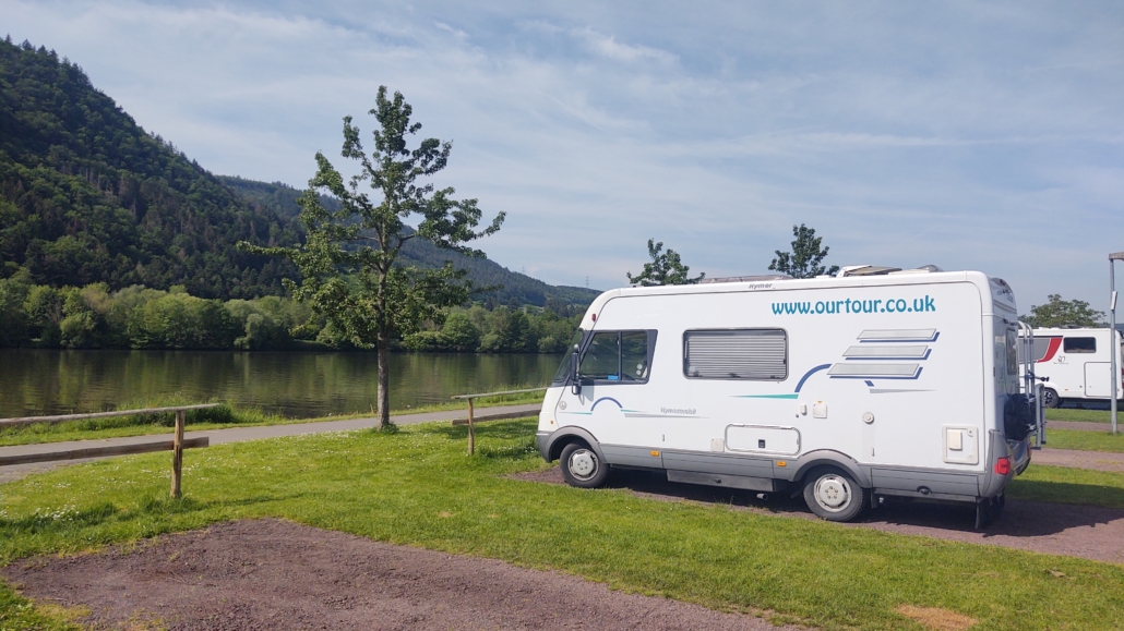 Motorhome parked facing the Moselle River on a stellplatz in Germany