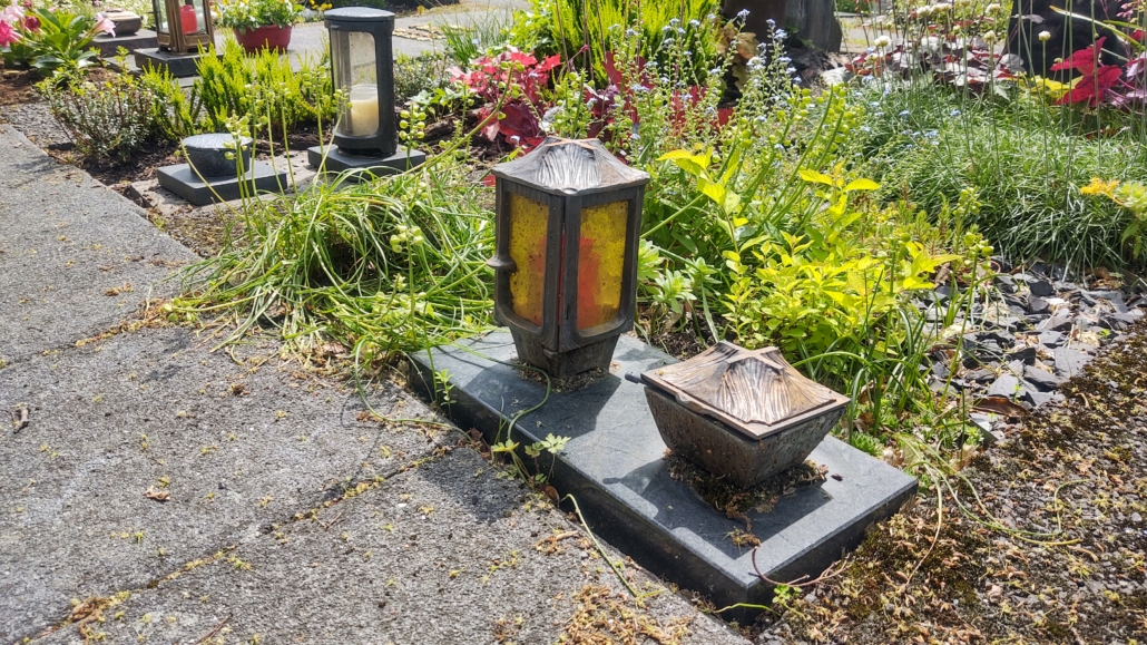 Each grave had a small candle, and the metal box next to it with a kind of small metal drumstick. Anyone know what it is?