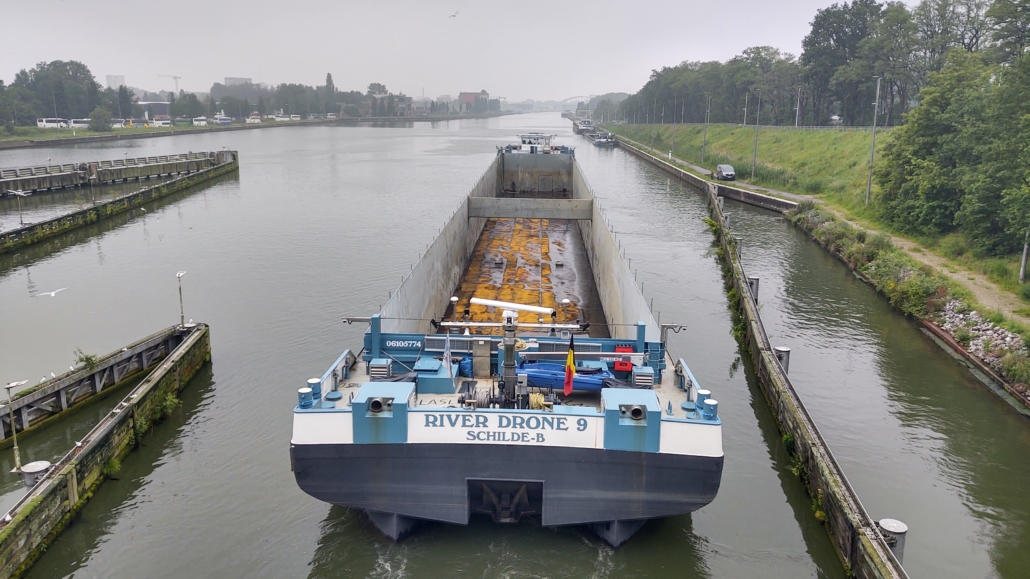 This 'River Drone' is driven remotely by on-shore personnel. There's a captain on board, but only as a supervisor. Amazing.