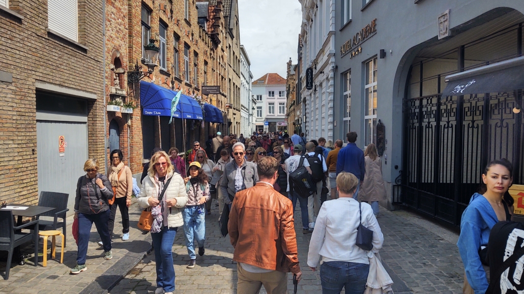 people in street bruges belgium