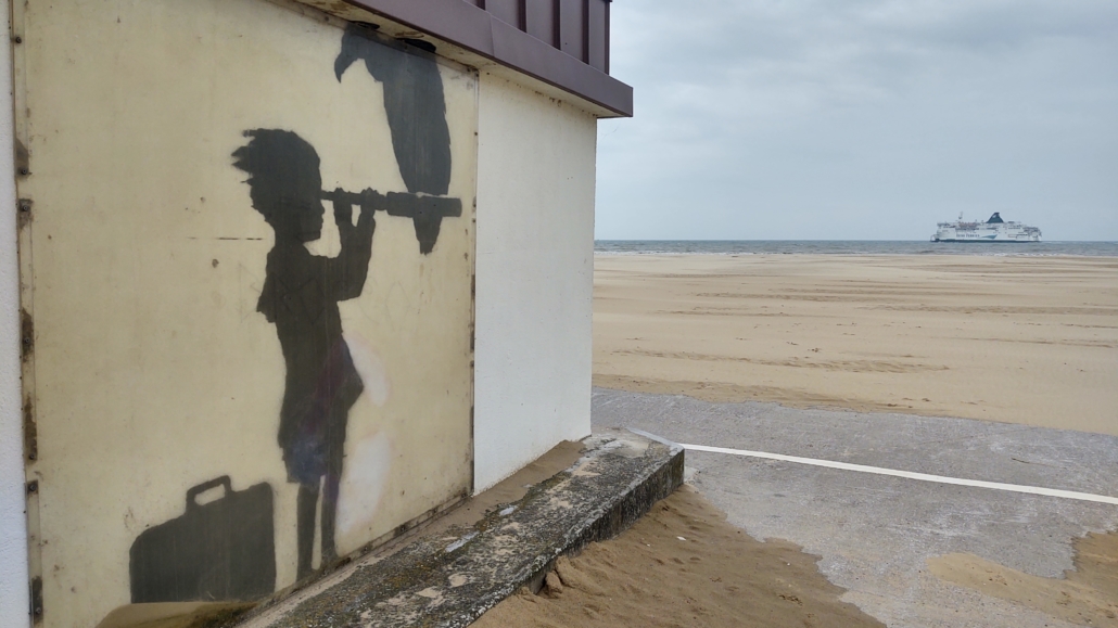 Banksy artwork in Calais. There are huge and fantastic colorful murals across the city