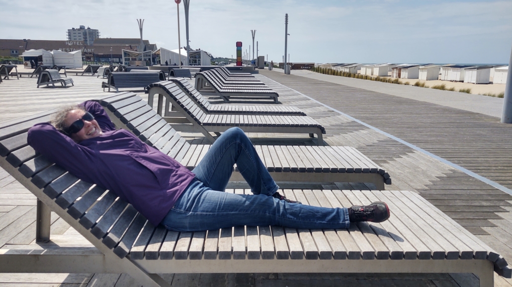 Ju taking in the sun (if there were any) at Calais promenade