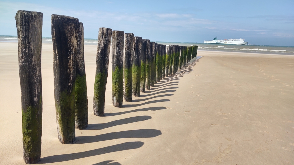 Ferries cruise past Calais beach all day and all night