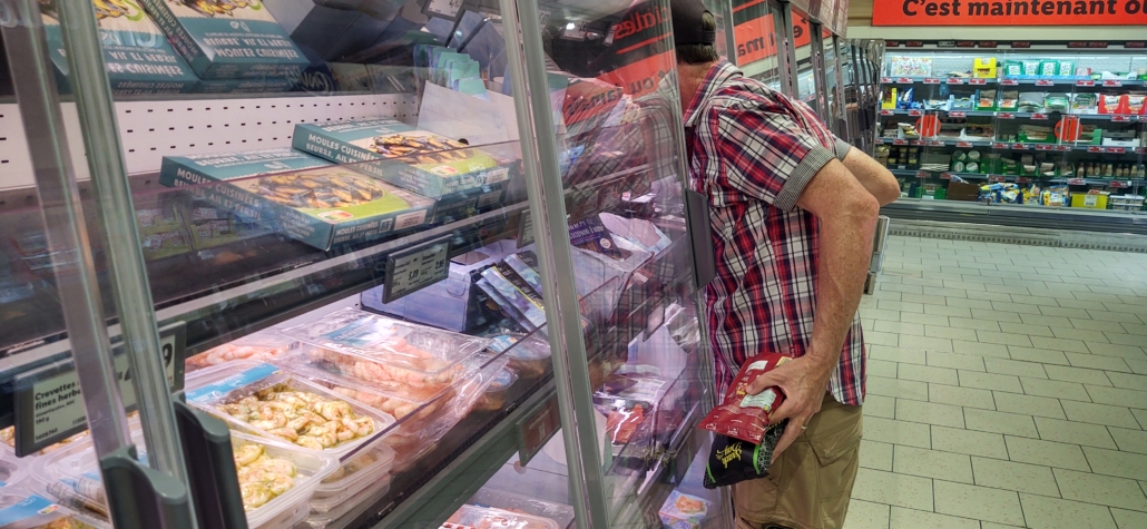 man with head in freezer