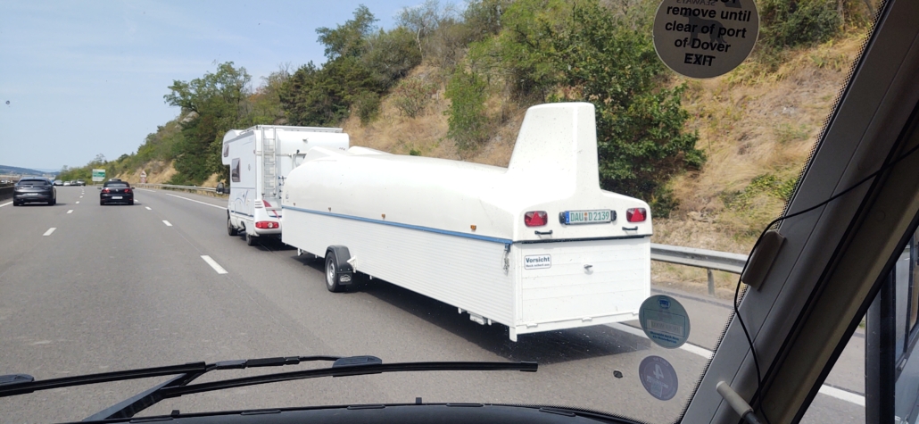 Motorhome towing a glider on a French toll road motorway