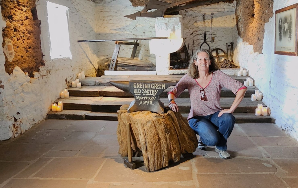 Ju in one of the Gretna Green marriage rooms complete with blacksmith anvil on a wooden block