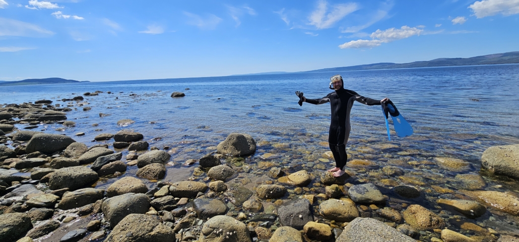 Jay in wetsuit about to go into the sea