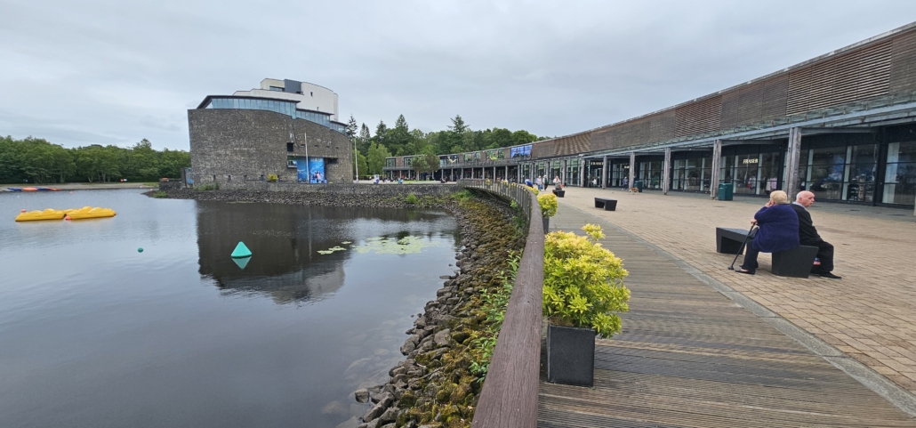 Sealife centre building and a row of shops on the shore of Loch Lomond in Balloch