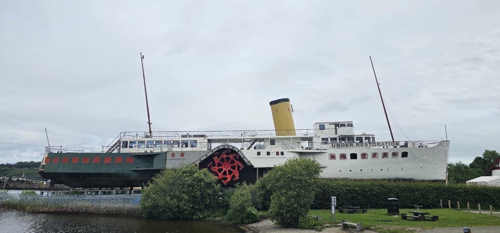 Paddle steamer boat on land next to loch lomond