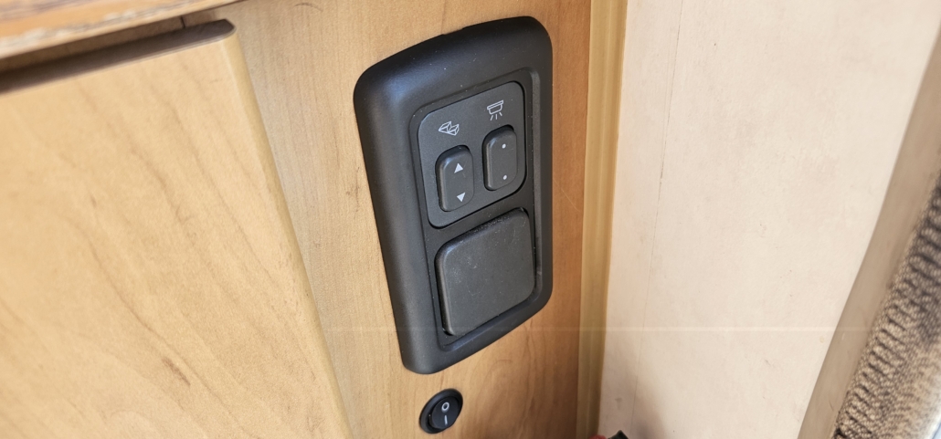 The habitation electric step switch and light switches on a 2001 Hymer B544 motorhome